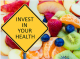 A road sign printed with the words: Invest in Your Health with a background of apples, peaches, oranges, and kiwi.