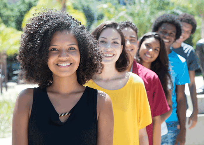 African american, Caucasian, and Hispanic young adults in a row