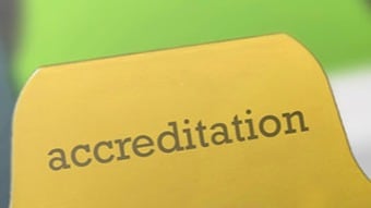 An image showing a manilla folder showing a tab that is named accreditation.