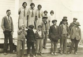 Sadie (top row, far left) attending the #19 Day School in Pine Ridge, South Dakota in 1923