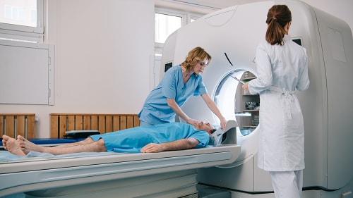 A patient entering a scan for a radiation medicine procedure.