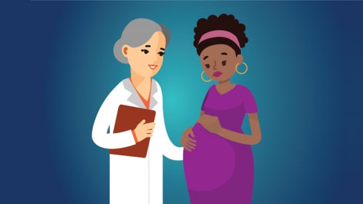 health care provider talking to a pregnant woman