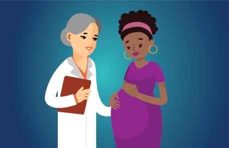 una mujer embarazada y su médico