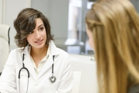 a healthcare provider talking to a patient