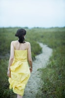 image of a woman walking on a path