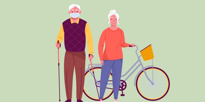 older man wearing a mask with cane next to older woman next to bicycle