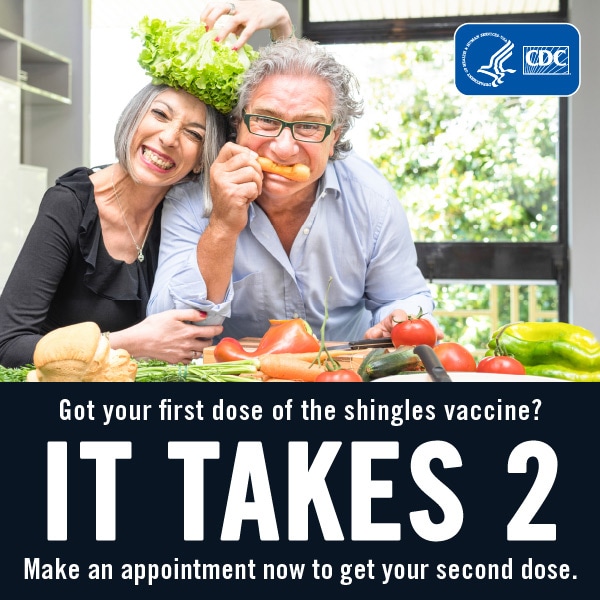 Got your first dose of the shingles vaccine? It takes 2. Make an appointment now to get your second dose. Couple smiling and eating veggies in the kitchen.
