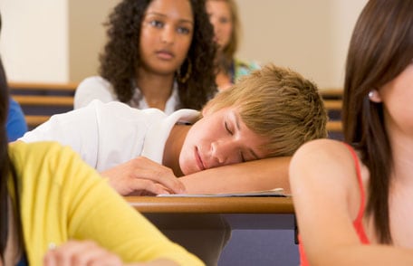 Boy sleeping in class