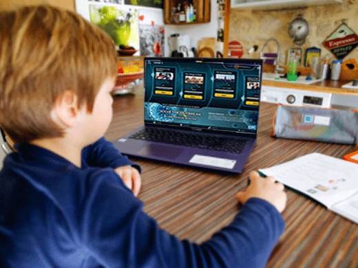 young boy on a laptop computer