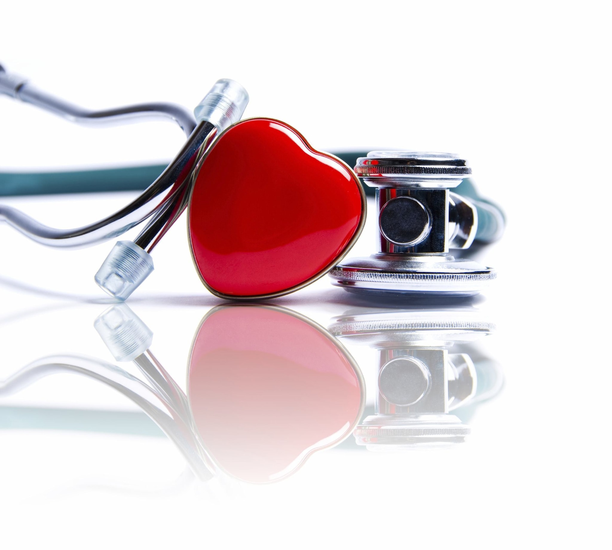 A heart pin leaning on a stethoscope