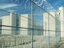 prison with barbed wire fence