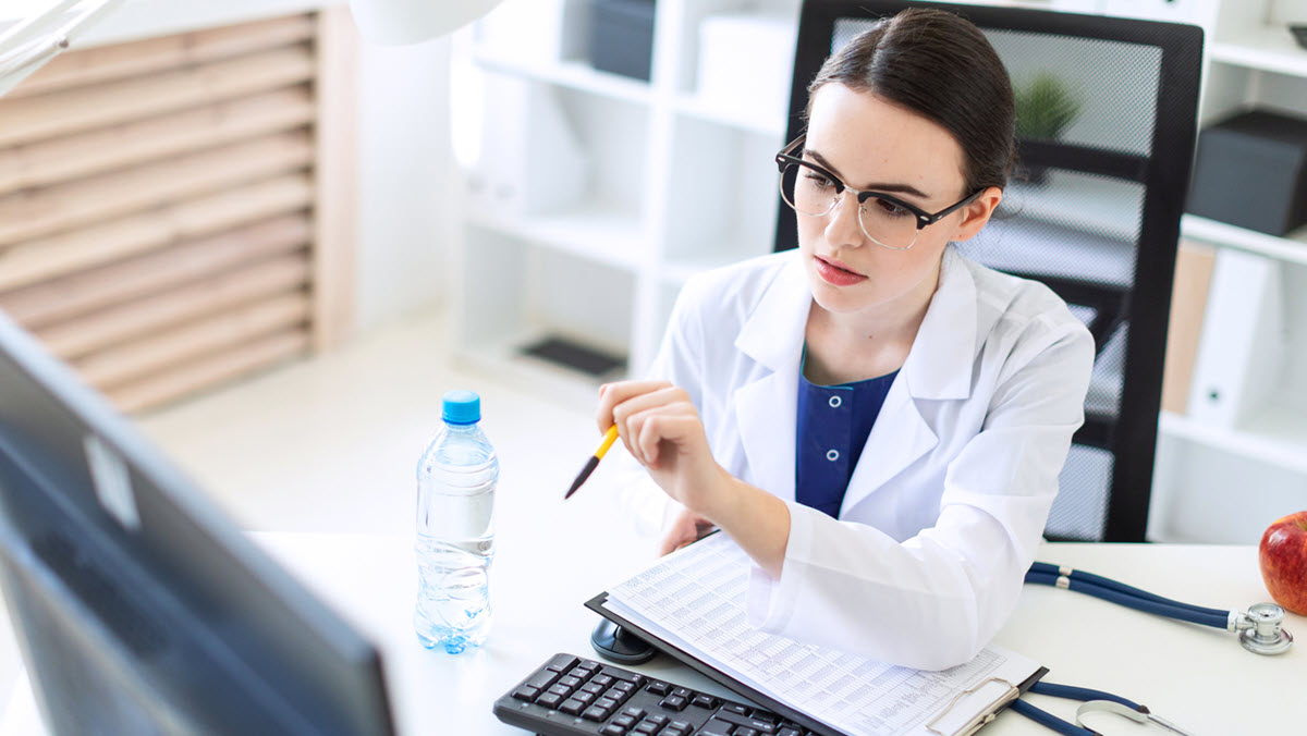 Healthcare provider looking at computer monitor