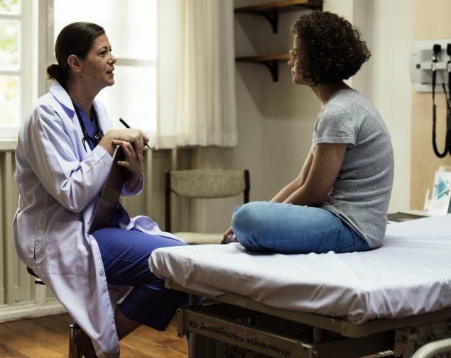 image of a doctor talking to a female patient
