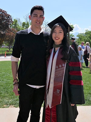 Photo of Janelle Trieu with Andrew Barili at her graduation