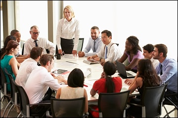 People in a meeting around a table