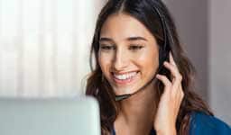 woman with headset on smiling