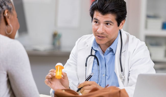Doctor talking to patient regarding medication.