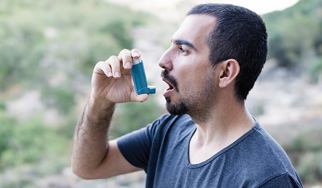 Man using inhaler