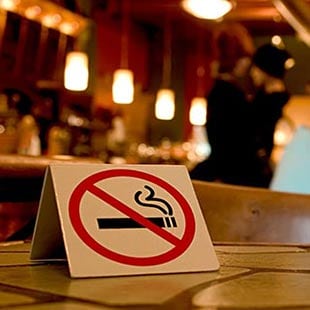 No smoking sign displayed prominently in a business.