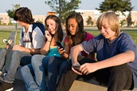 Group of teens sitting down.