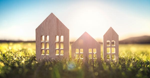 Wooden houses on grass