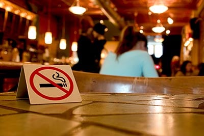 No smoking sign on a table in restaurant.