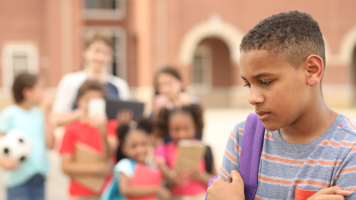 young boy being bullied at school