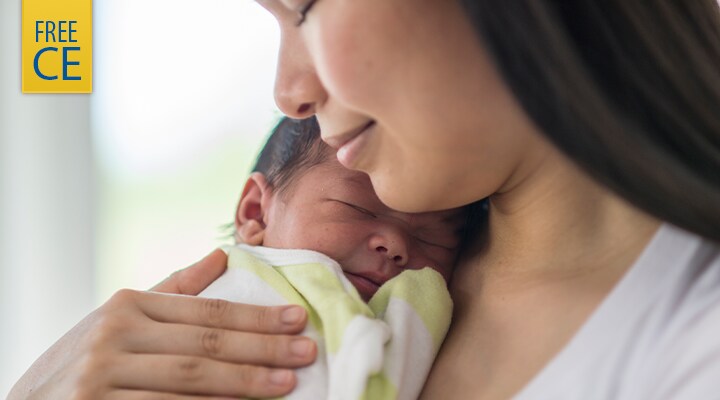 Newborn infant with mother