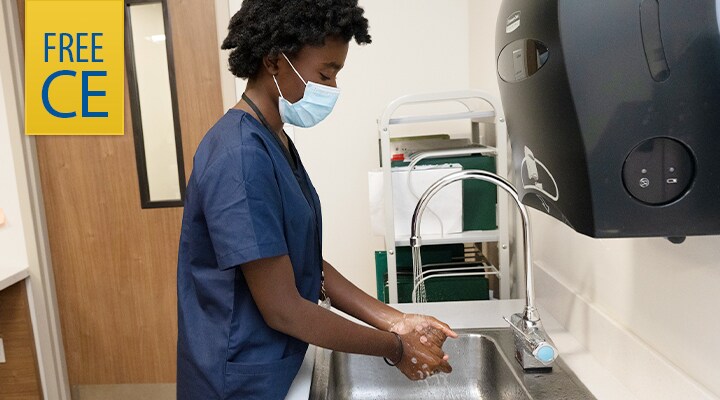 Healthcare worker washing her hands