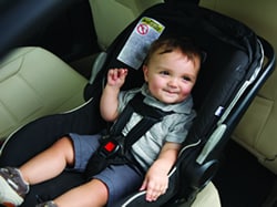 Young boy in car seat