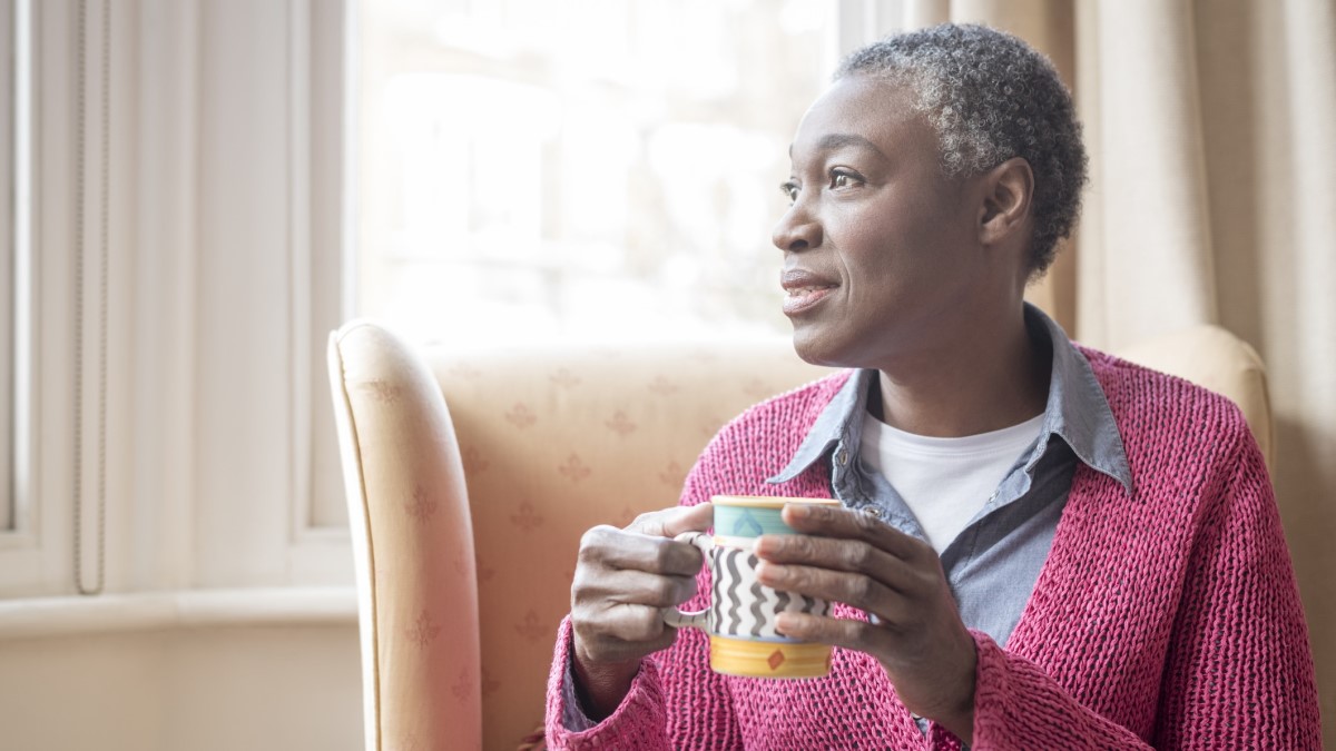 Photo of a woman drinking coffee