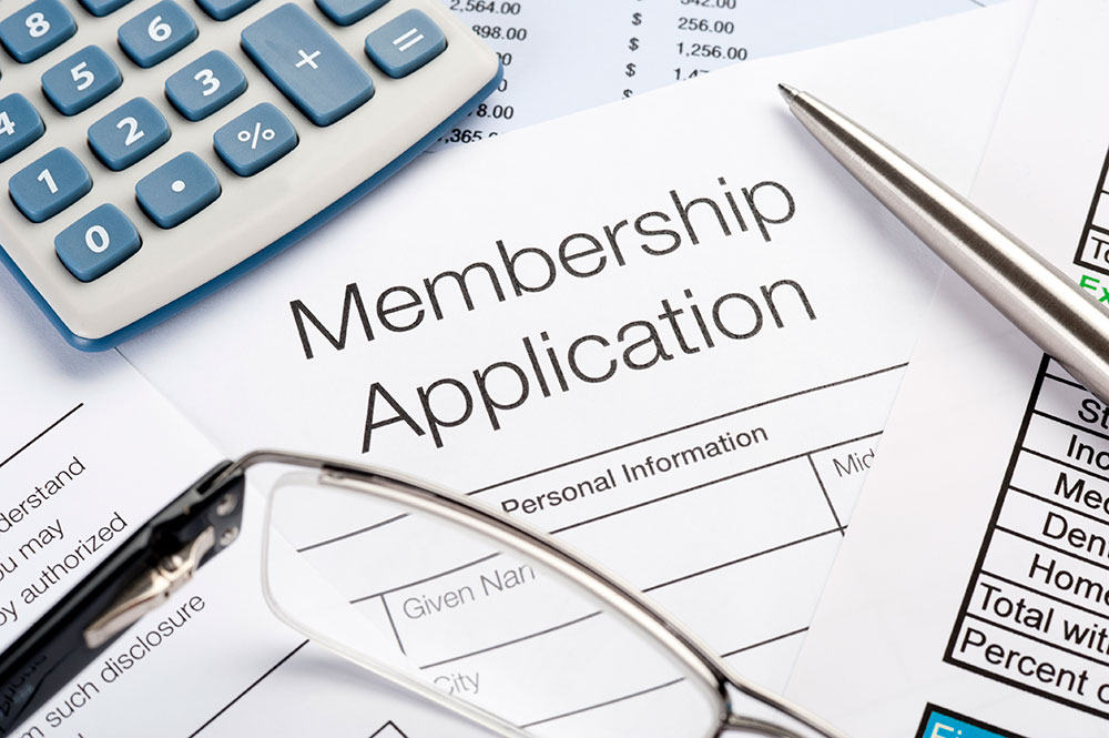 Membership application Form with pen and calculator