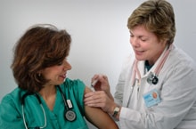 healthcare worker getting vaccinated.