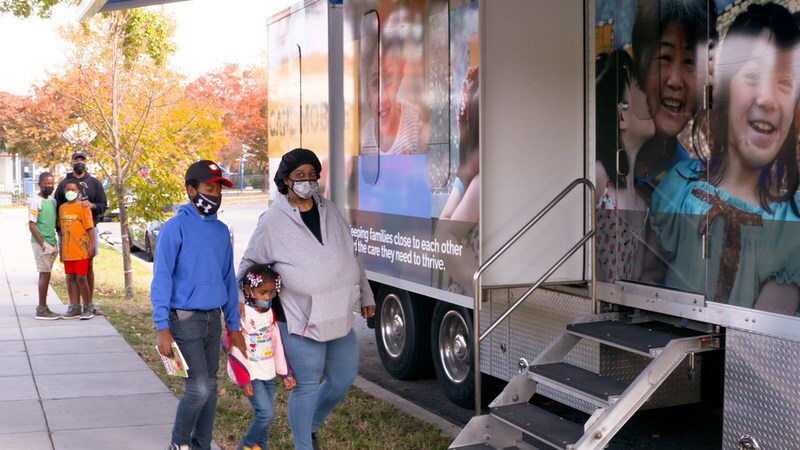Families receiving a COVID-19 vaccine for eligible children at the Kids Mobile Medical Clinic/Ronald McDonald Care Mobile.
