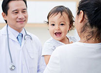 hcp-edu-child-vacc-04 Doctor talking to mother and baby