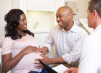 hcp-edu-maternal-vacc-02 Husband holding wife's pregnant belly
