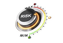 Photo of a dial labeled 'Risk' over a gauge showing 'MIN' and 'MAX'