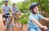 young couple with son riding bikes