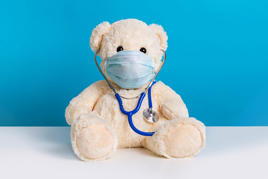 Teddy bear with protective medical mask and stethoscope