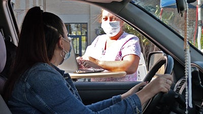 patient arrives at drive through flu vaccination clinic