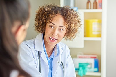 Female healthcare provider talking to patient
