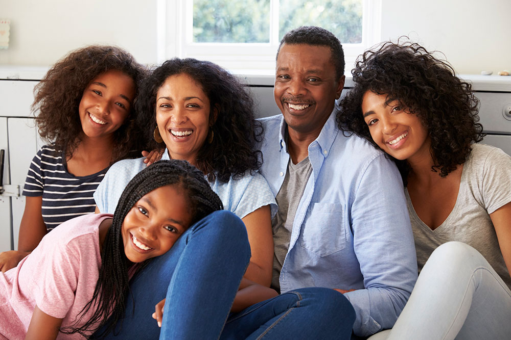 Mother and father with 3 teenaged daughters.