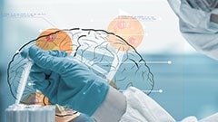 A photo illustration that shows a gloved scientist with a pipette superimposed over a drawing of a brain.