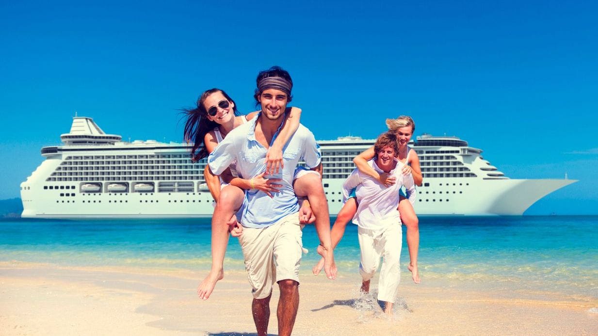 People smiling in front of a cruise ship