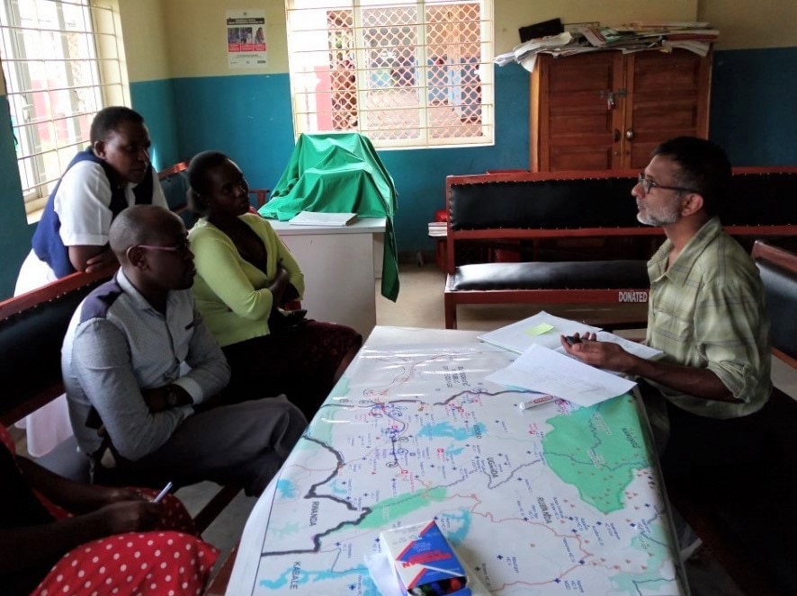 CDC’s Satish Pillai, right, leads a participatory mapping session