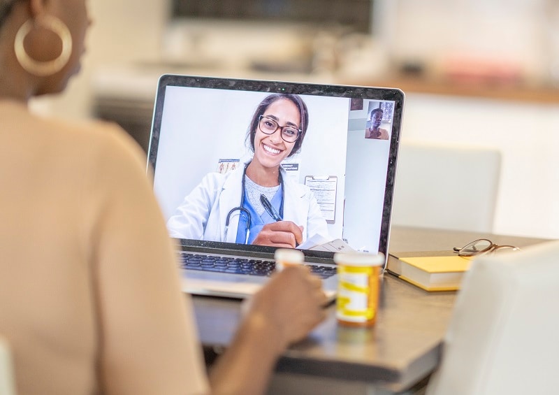 Woman having a telemedicine visit with her doctor.