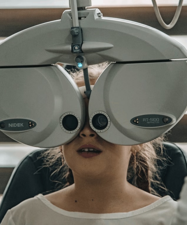 girl getting eyes checked