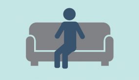 figure alone on sofa