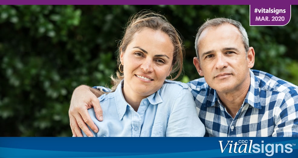 Photo of a man and woman that could be in their early 50s, when it’s time to get screened for colorectal cancer. The man’s arm is around the woman’s shoulder.