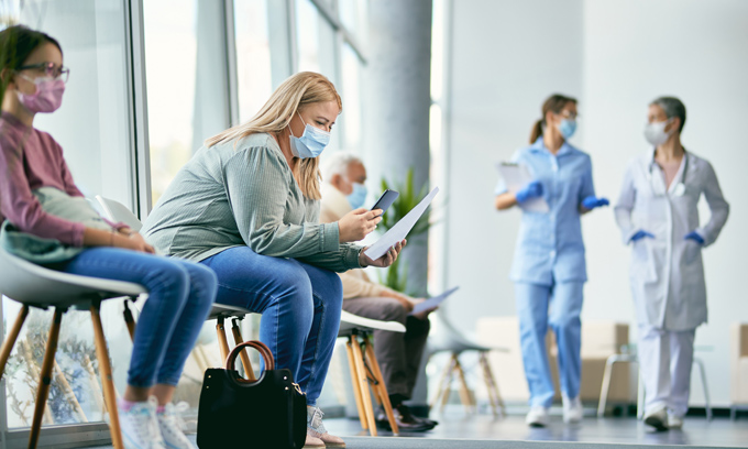 Patients waiting in a hospital lobby
